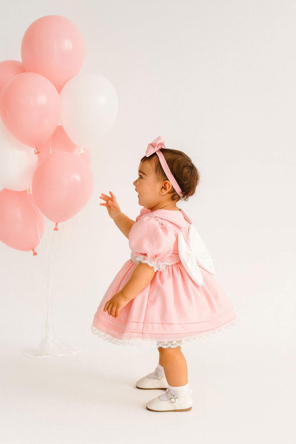 Vintage-Inspired Baby Girl Pink Puff Sleeve Dress with Lace Trim and Bow